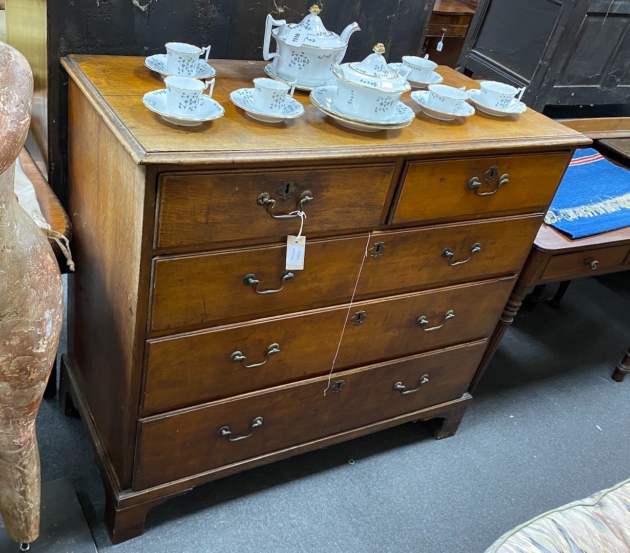 A George III oak chest of two short and three long drawers, width 111cm, depth 52cm, height 99cm